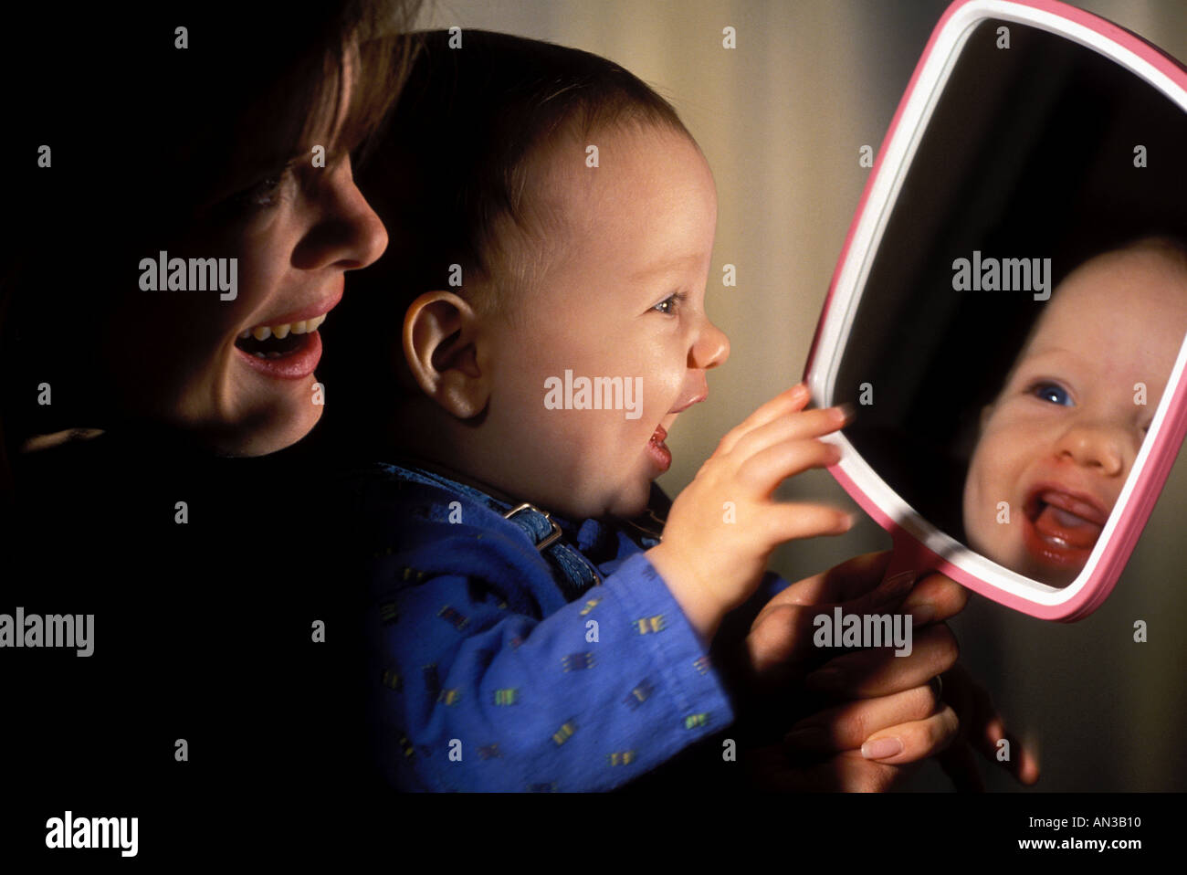 Showing mirror to clearance baby
