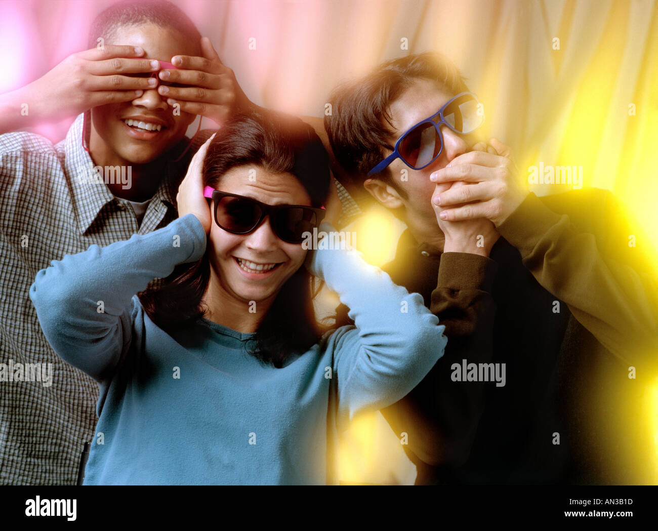 Teenagers demonstrating Hear No Evil See No Evil Speak No Evil Stock Photo