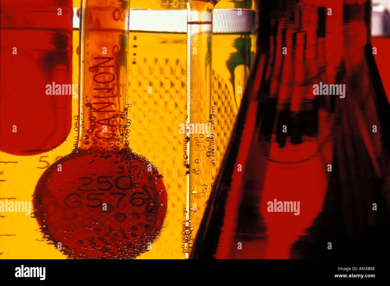 Close up scientific still life of flasks and beakers with dye