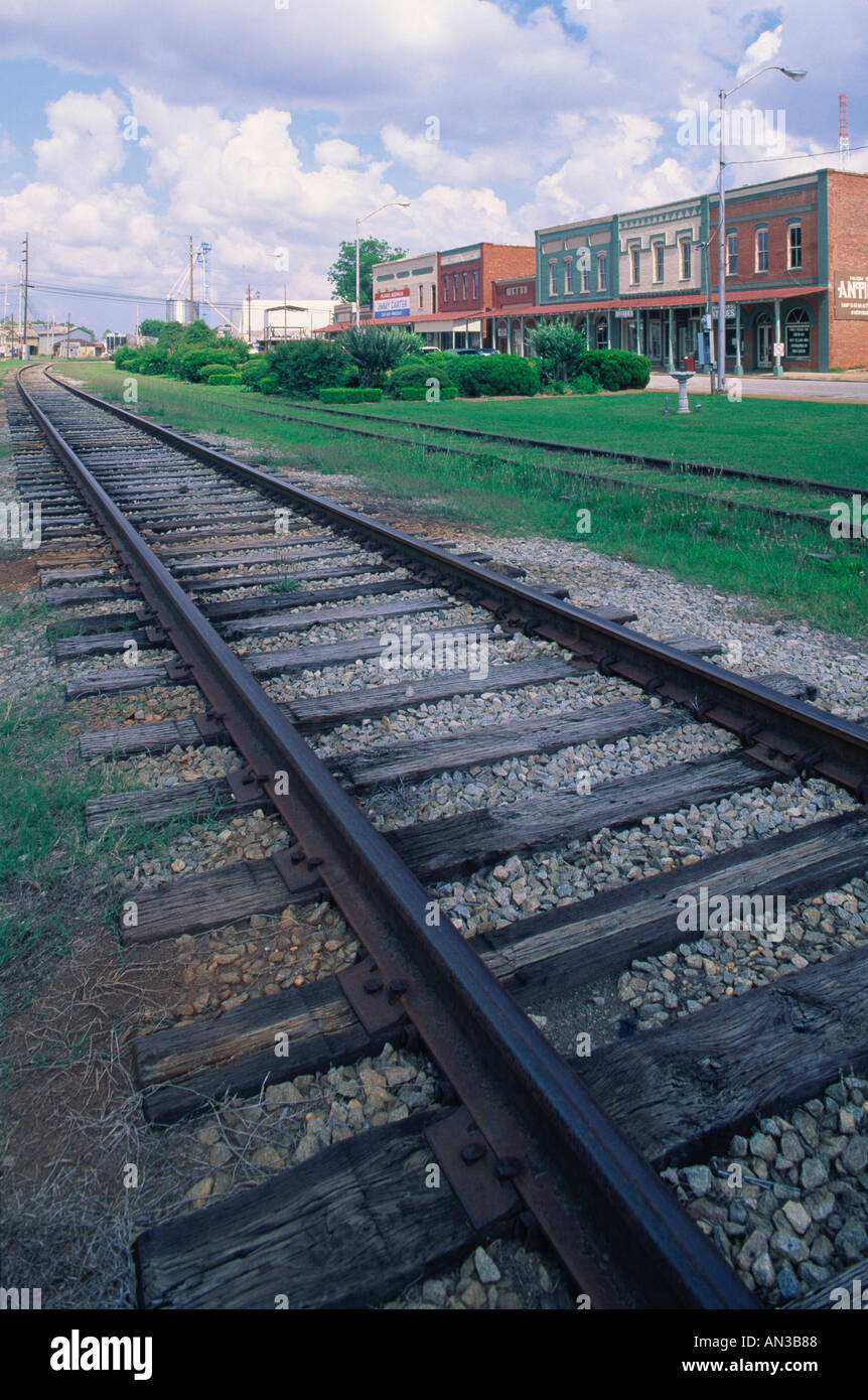 Railroad Train tracks in small town disappearing on the horizon Plains
