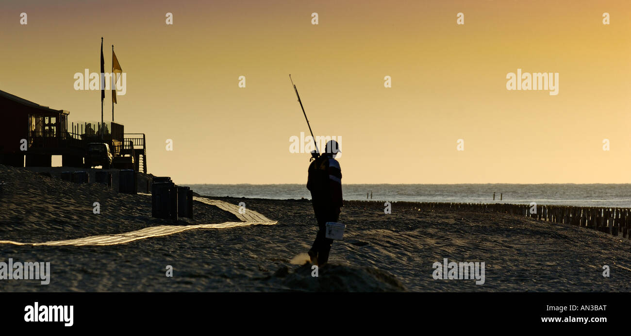 fisherman at sunset Stock Photo - Alamy