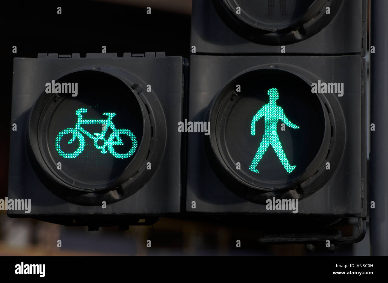 green pedestrian and cyclist traffic crossing lights Stock Photo - Alamy