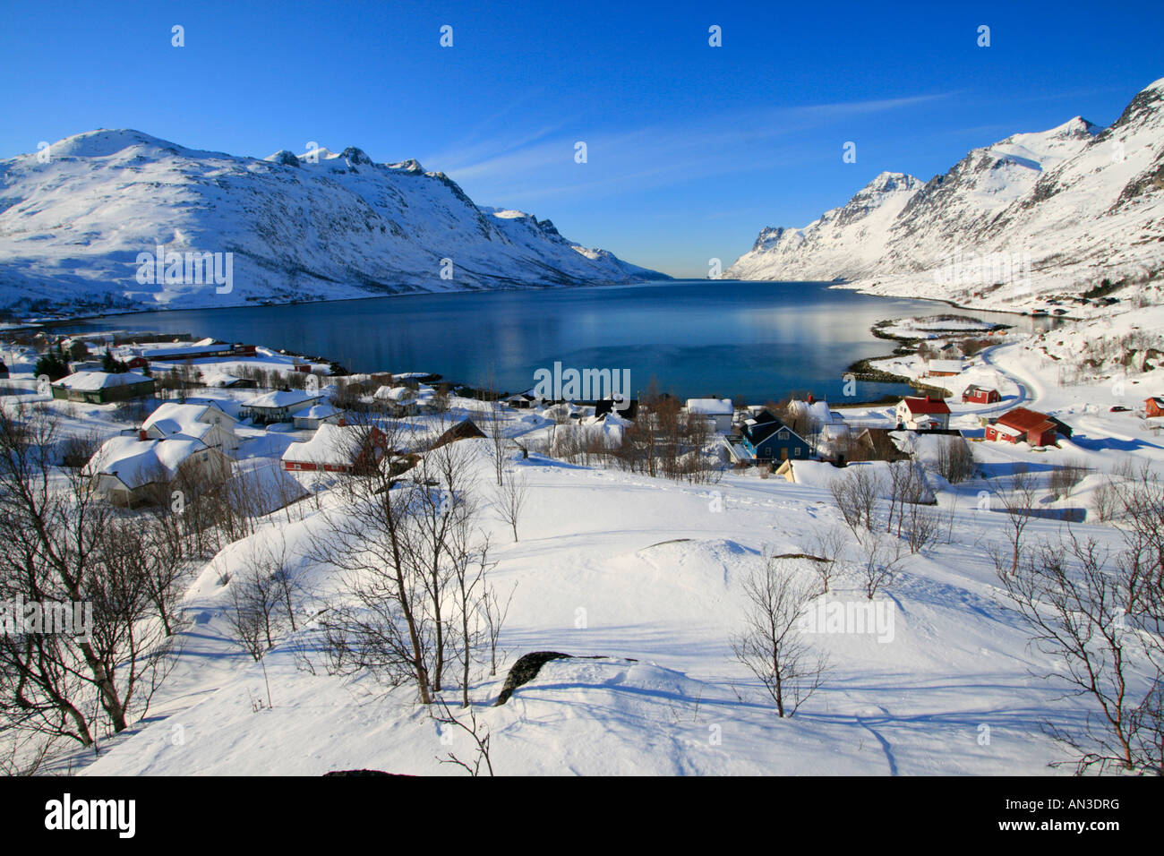 ersfjordbotn fjord Kvaløya winter snow scene tromso norway arctic circle Stock Photo