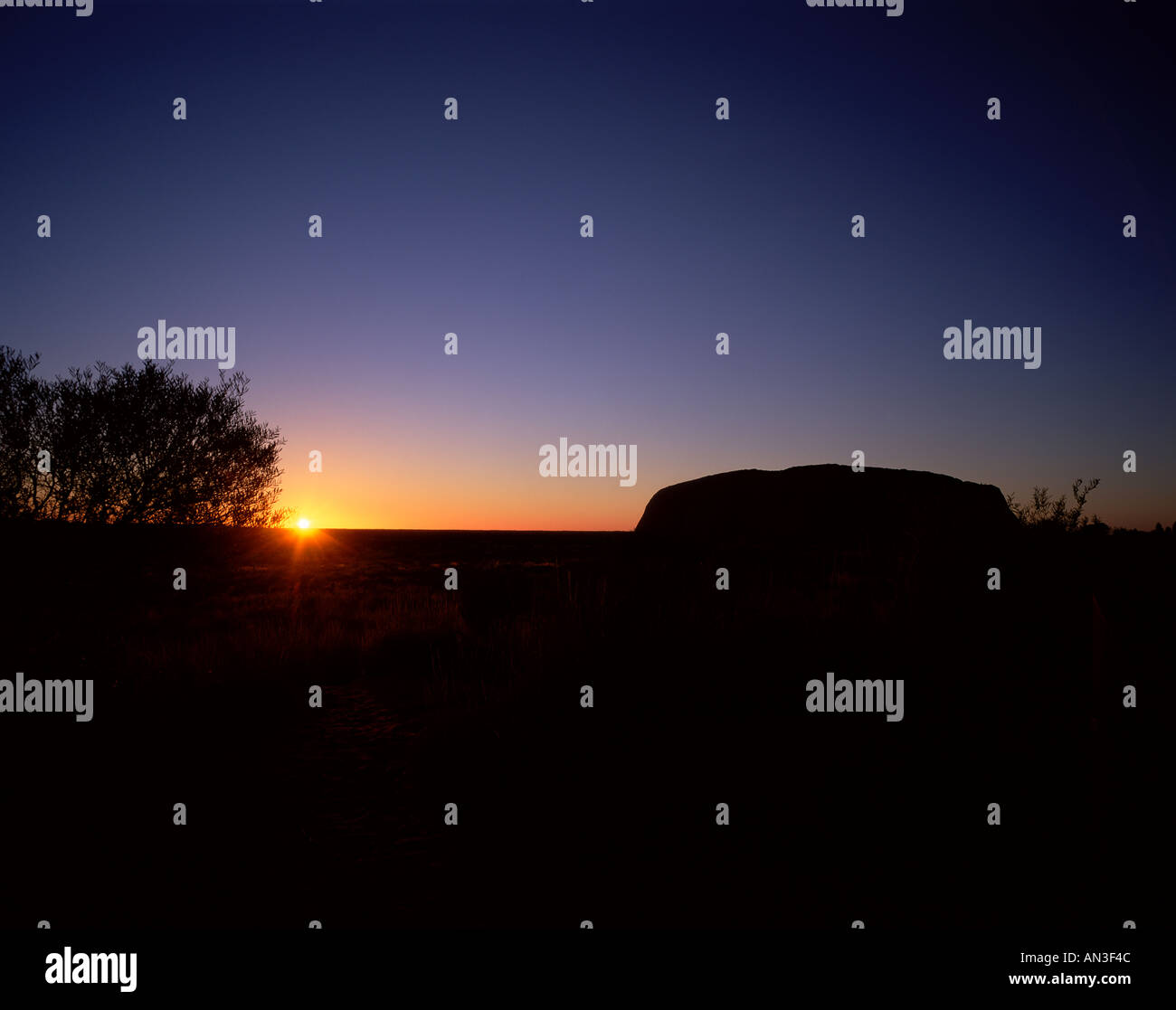 Sunrise sunset at Ayres Rock Uluru NT Australia Stock Photo