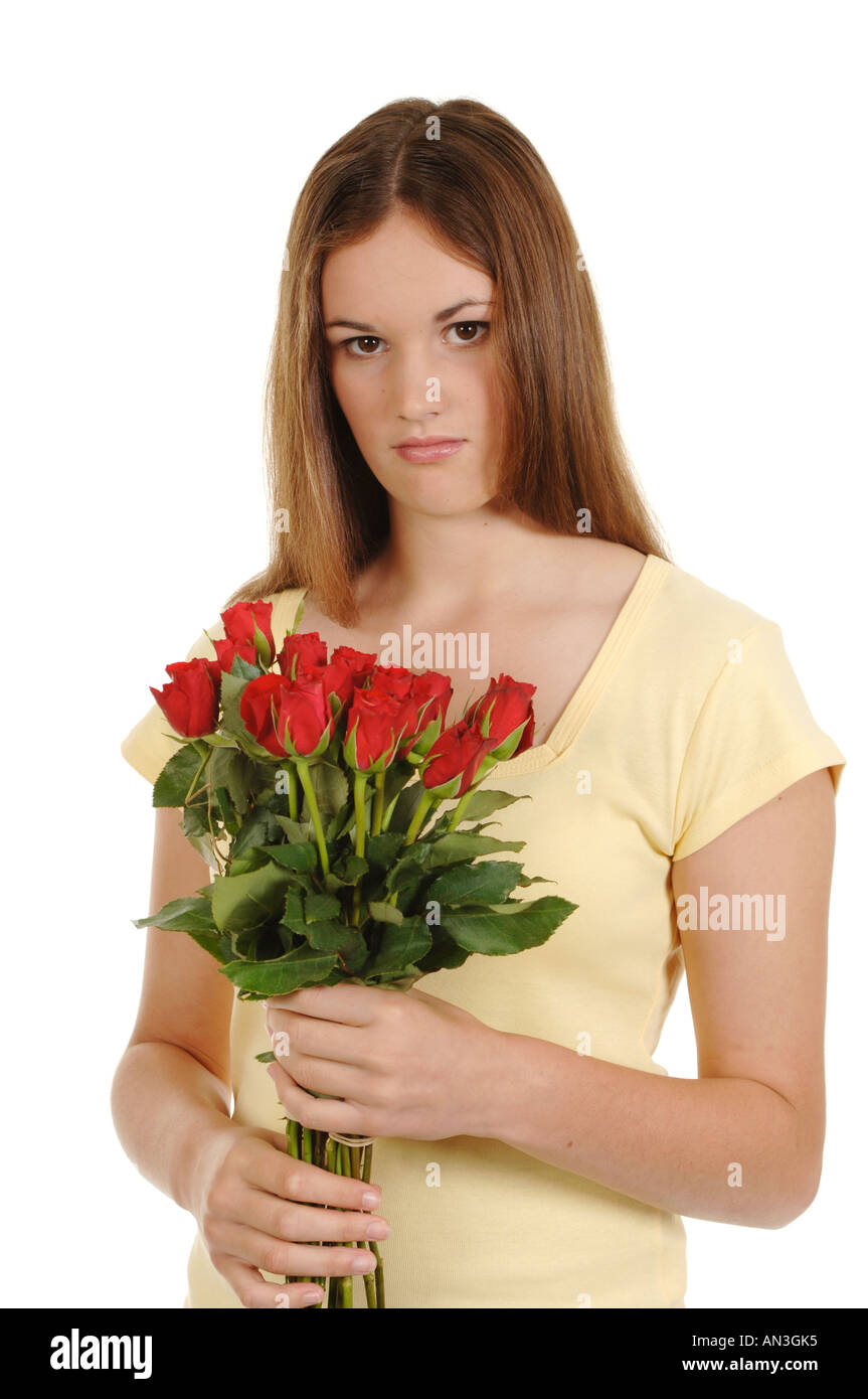 a teenage girl with a bunch of red roses looking sad Stock Photo - Alamy