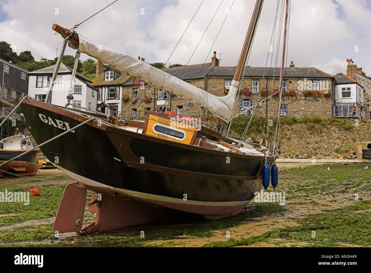 Mousehole Harbour Cornwall at low tide Stock Photo
