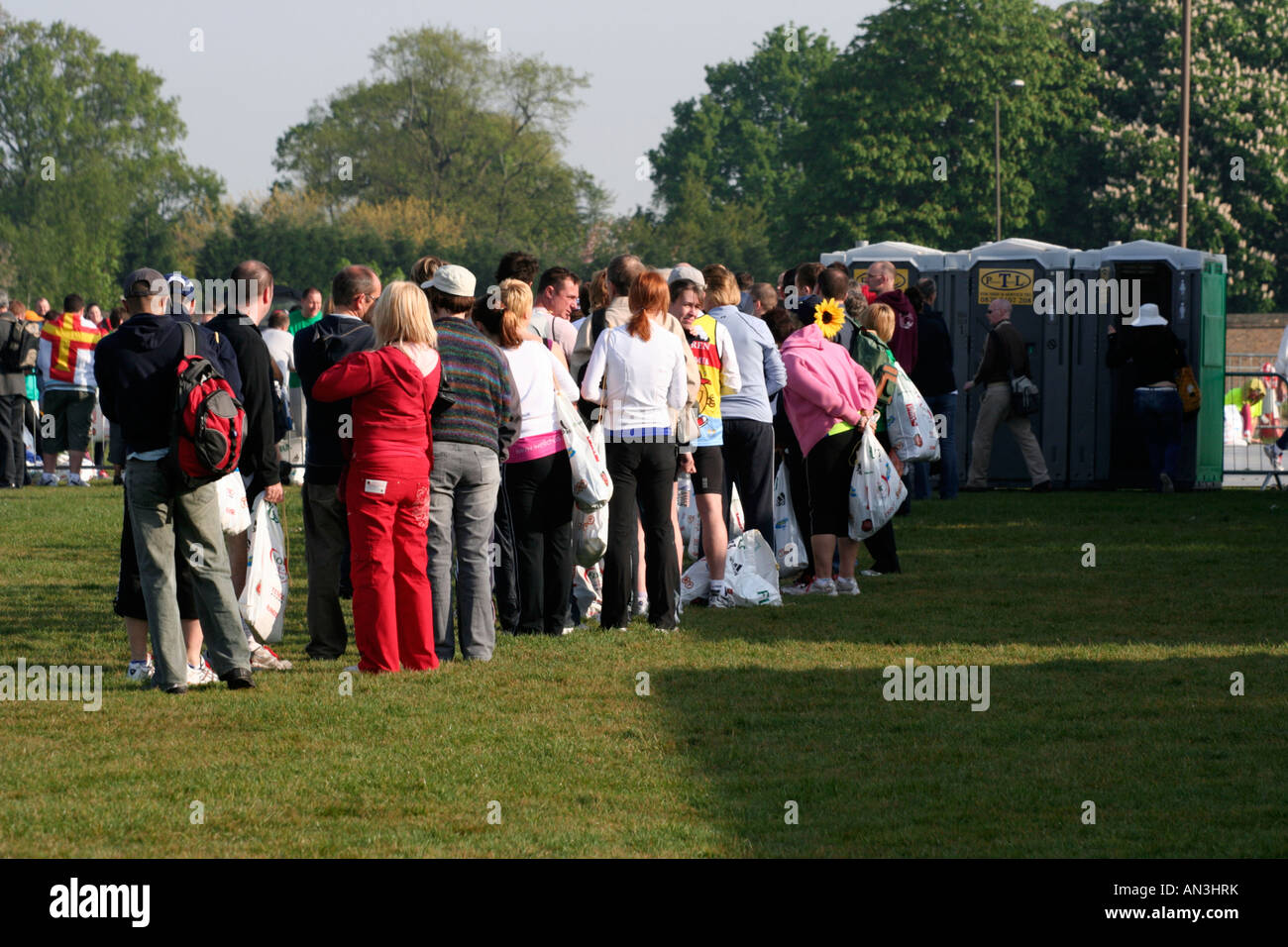 Queue for the toilet Stock Photo Alamy
