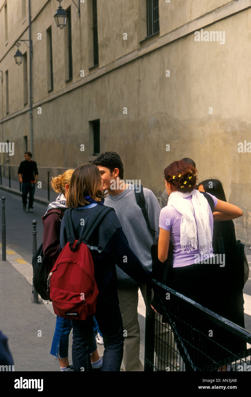French students, French teens, French teenagers, greeting, kiss on cheek, kissing on cheek, Lycee Charlemagne, Marais District, Paris, France, Europe Stock Photo