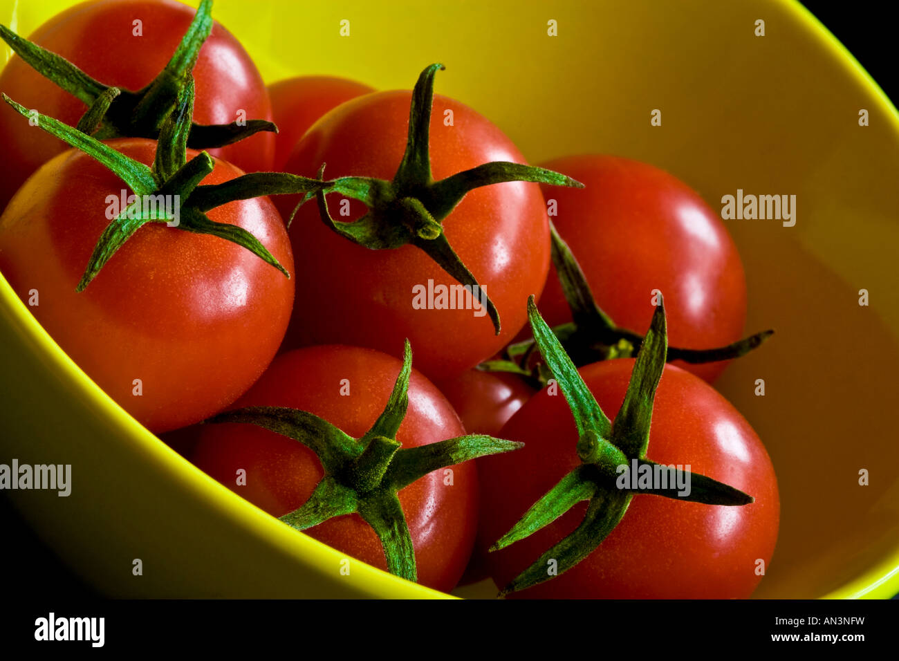 Red Cherry Tomatoes in a Green Yellow Bowl Stock Photo - Alamy