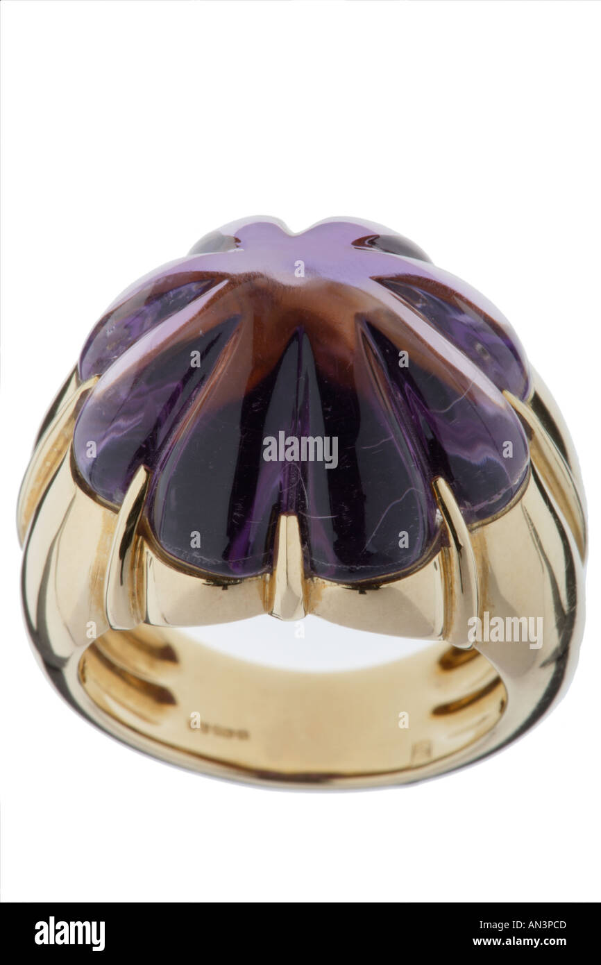 Purple gemstone on gold ring Stock Photo - Alamy