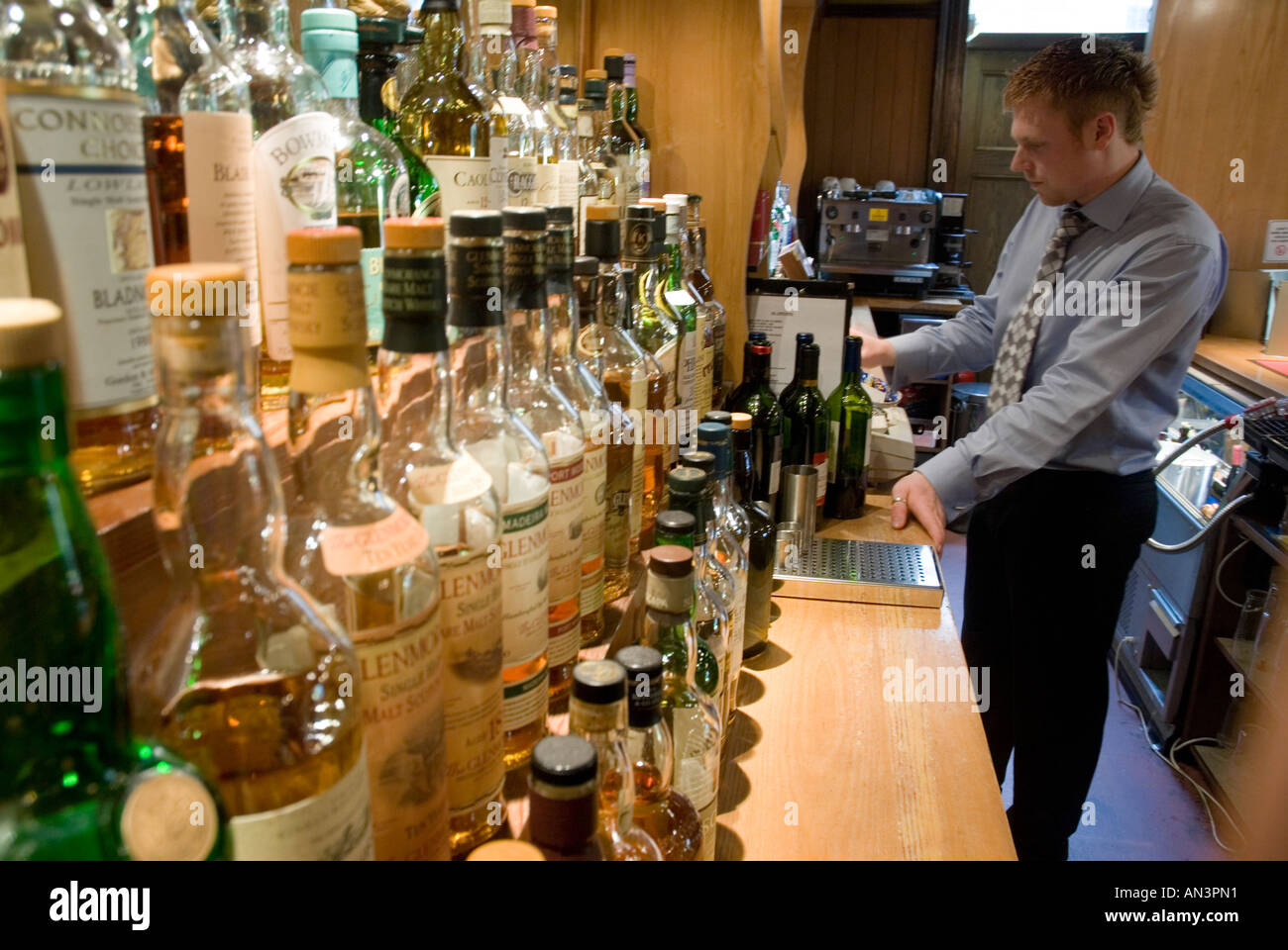 Barman in the Bar Using the Till Stock Photo