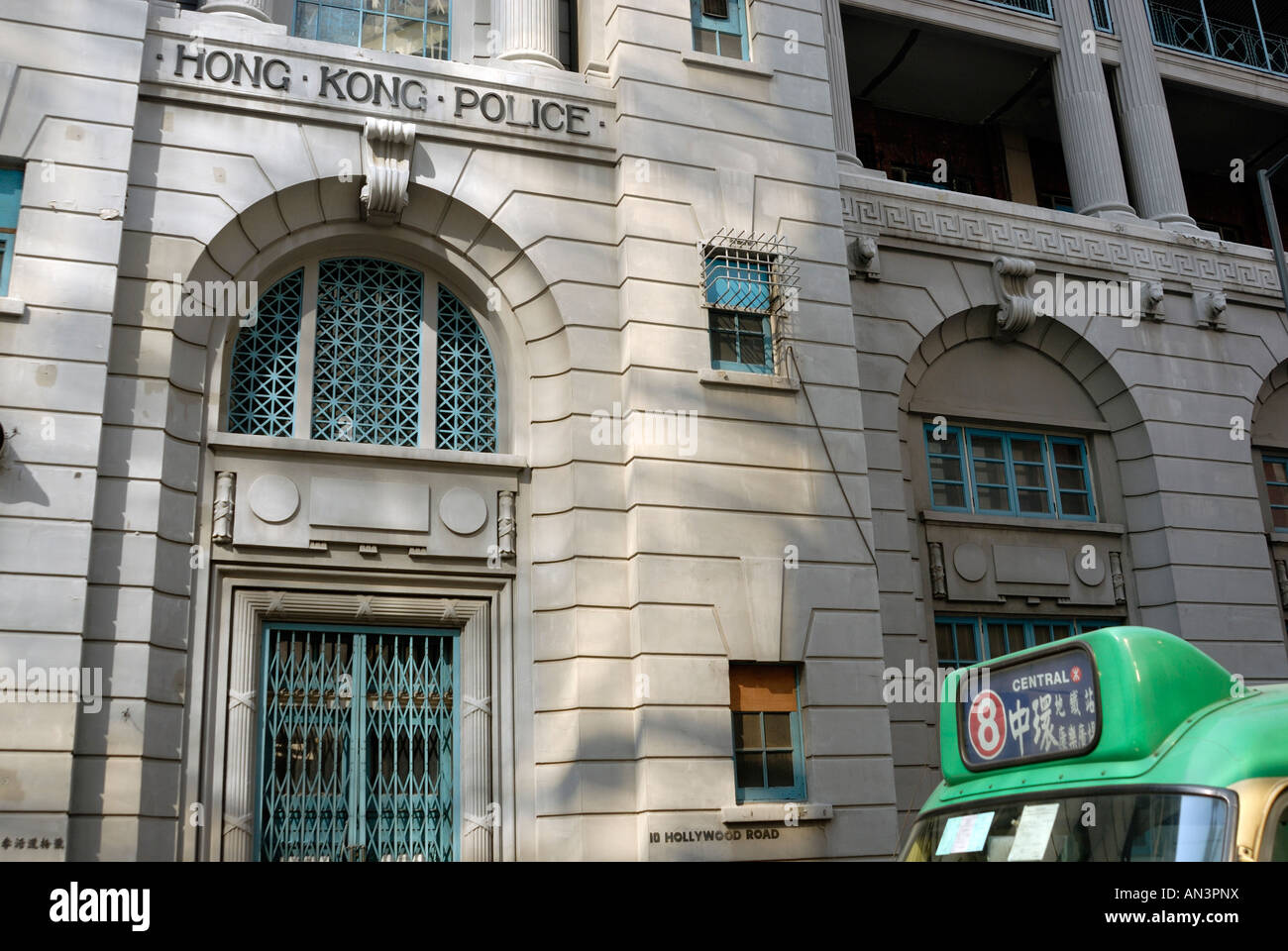 Old Hong Kong police station with bus bound for Central Stock Photo
