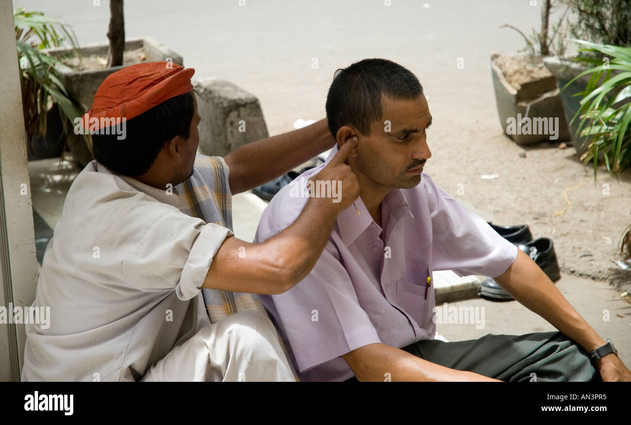 Ear cleaner working in the streets of Delhi Stock Photo Alamy