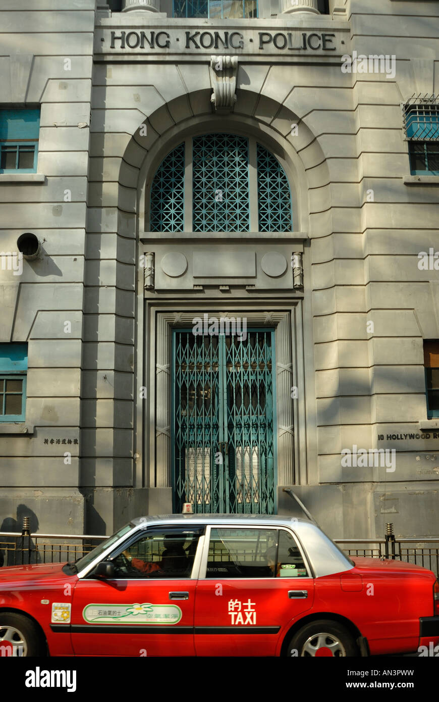 Old Hong Kong police station with taxi Stock Photo