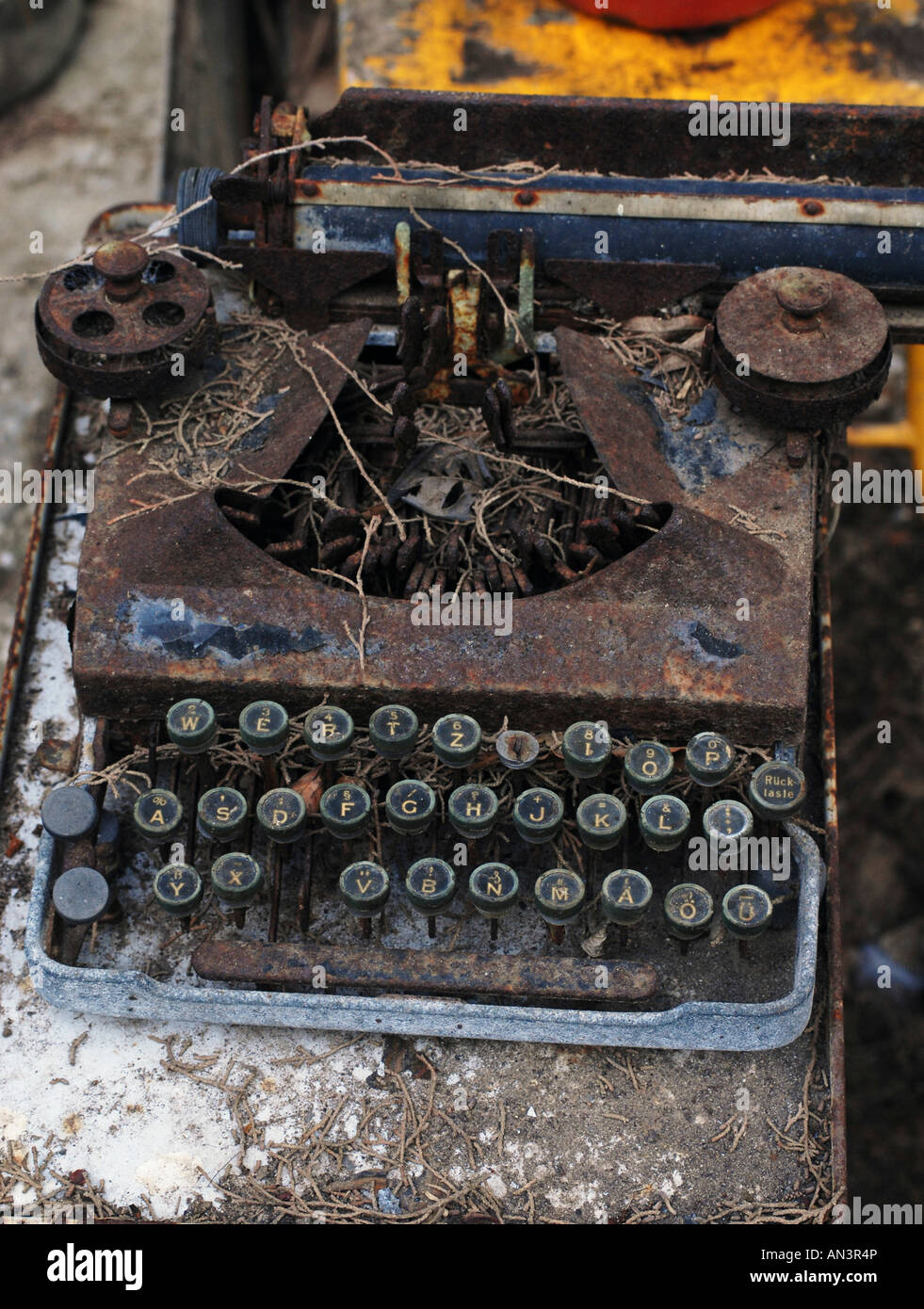 Old style typewriter in a ruined and neglected condition Stock Photo