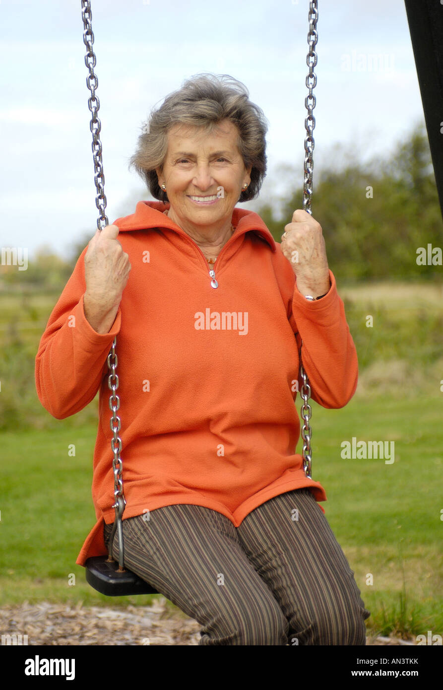 Older woman swinging hi-res stock photography and images - Alamy