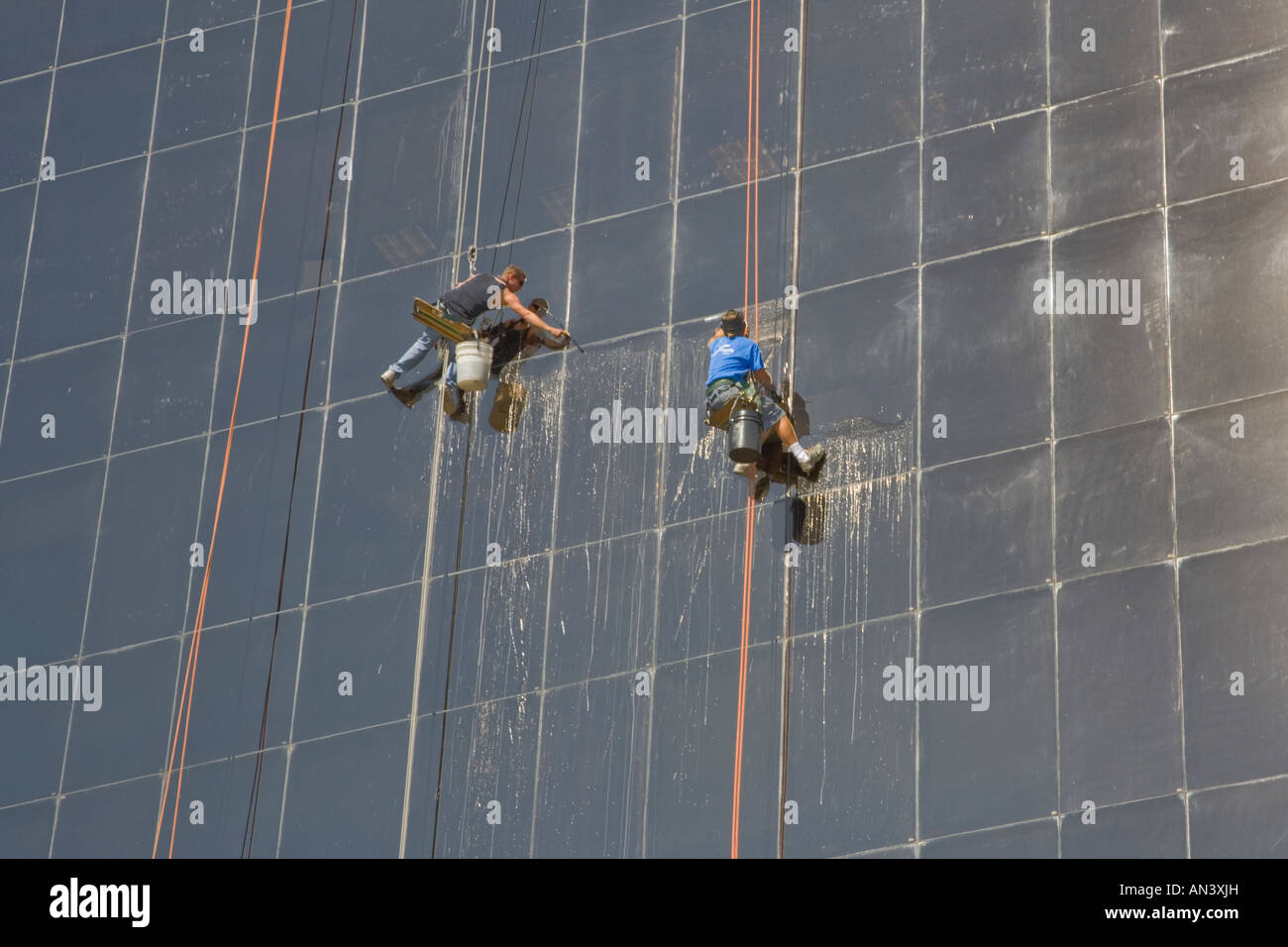Window washers on building in downtown Sarasota Florida Stock Photo