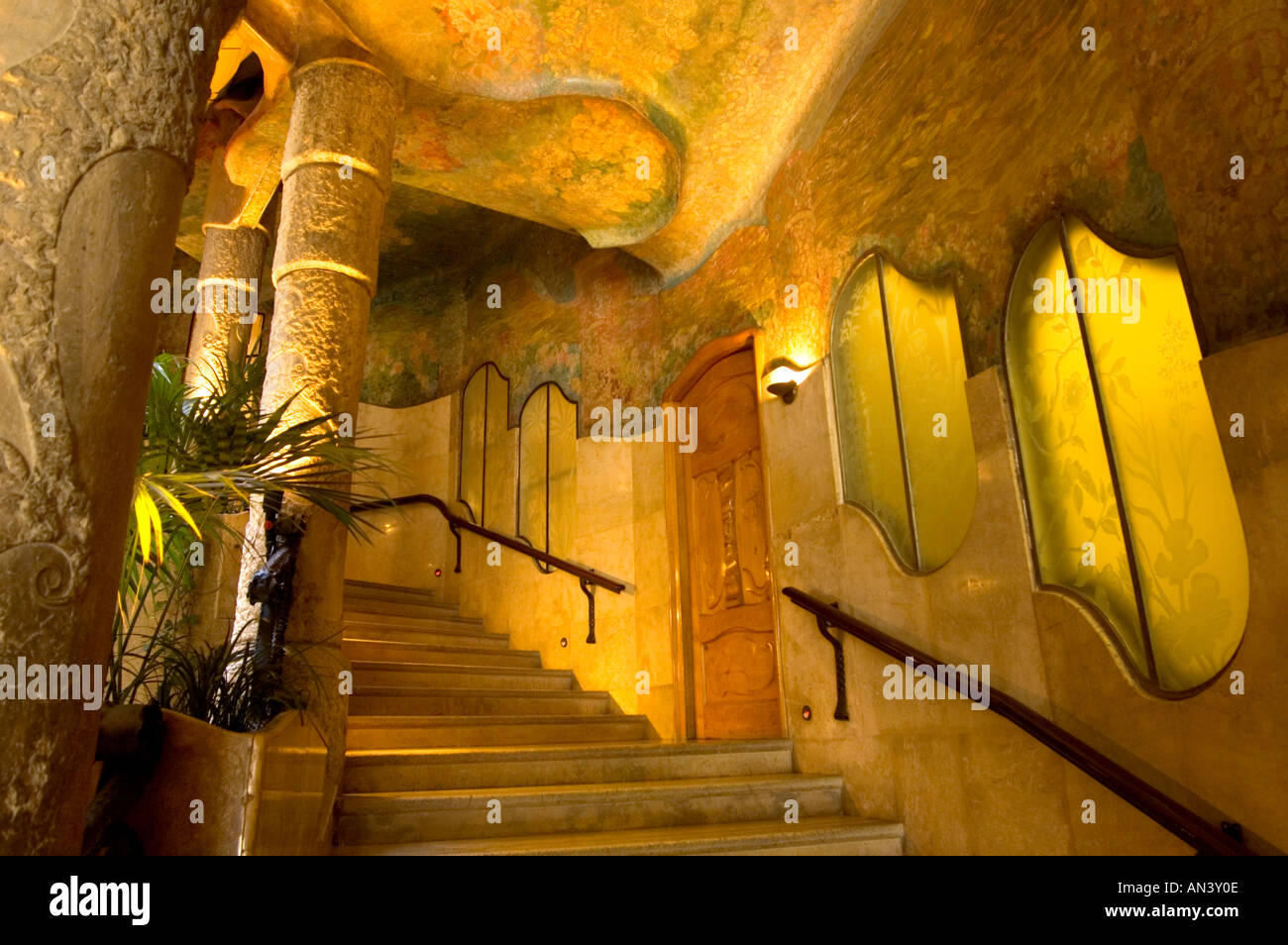 Ornate staircase inside courtyard of La Pedrera apartment block designed by Catalan architect Antoni Gaudí Barcelona Spain Stock Photo