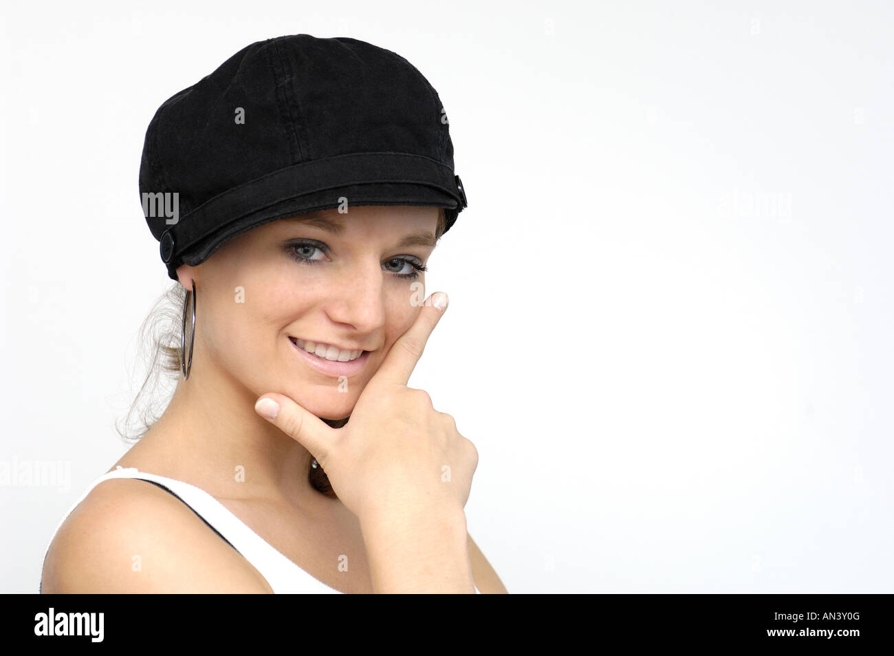 young woman with black cap Stock Photo