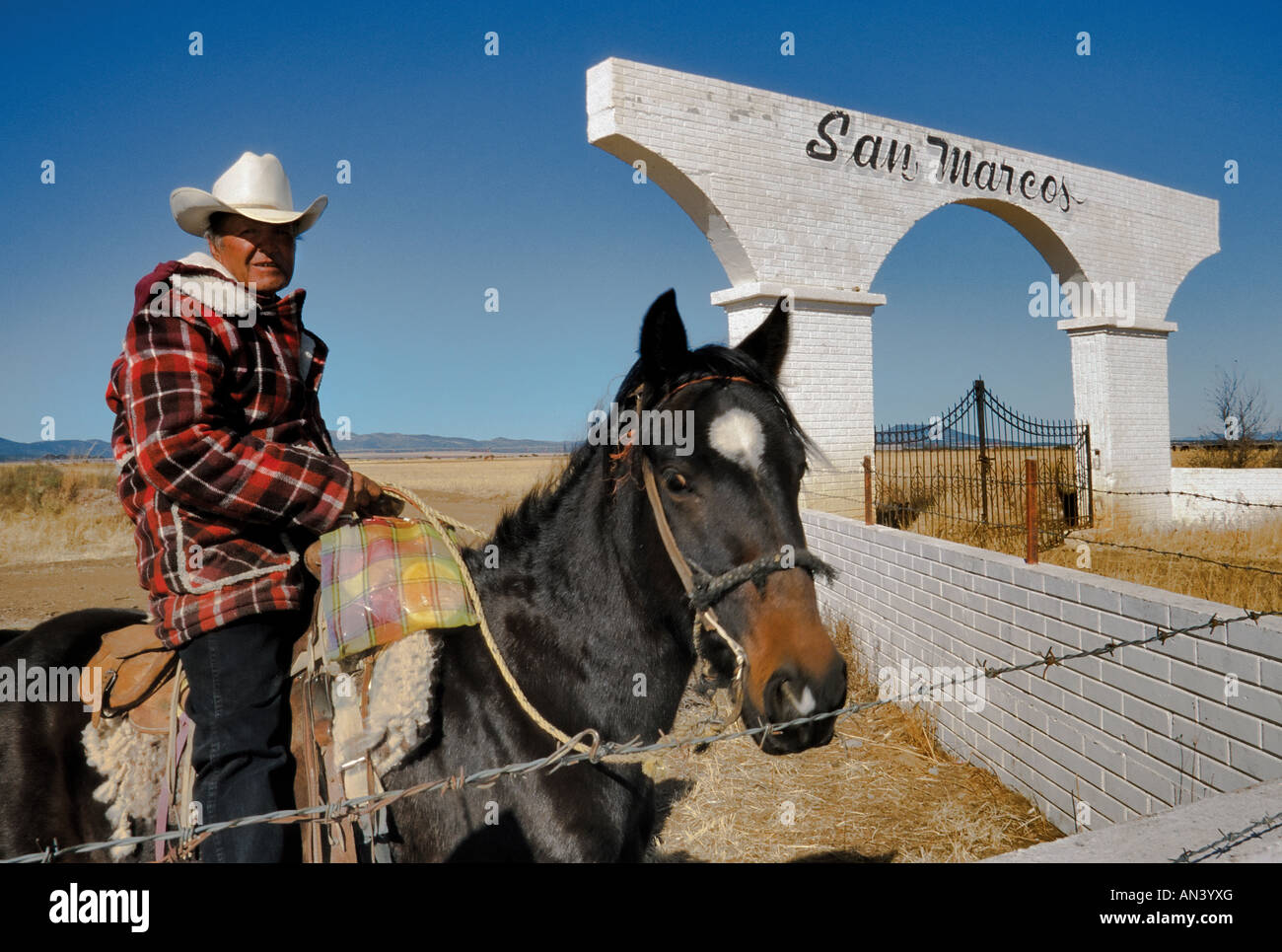 Vaquero at ranch gate near Guerrero, State of Chihuahua, Mexico Stock Photo