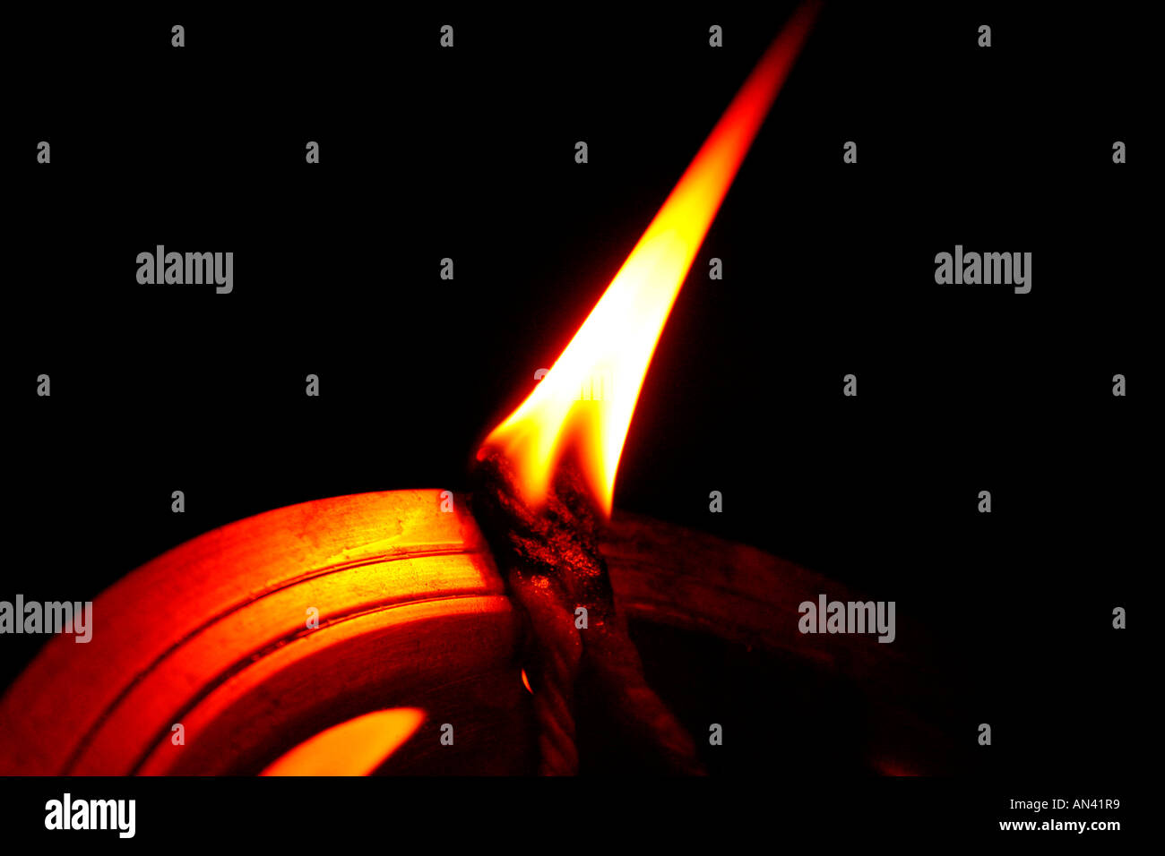Flame from a traditional lamp in Kerala, India Stock Photo