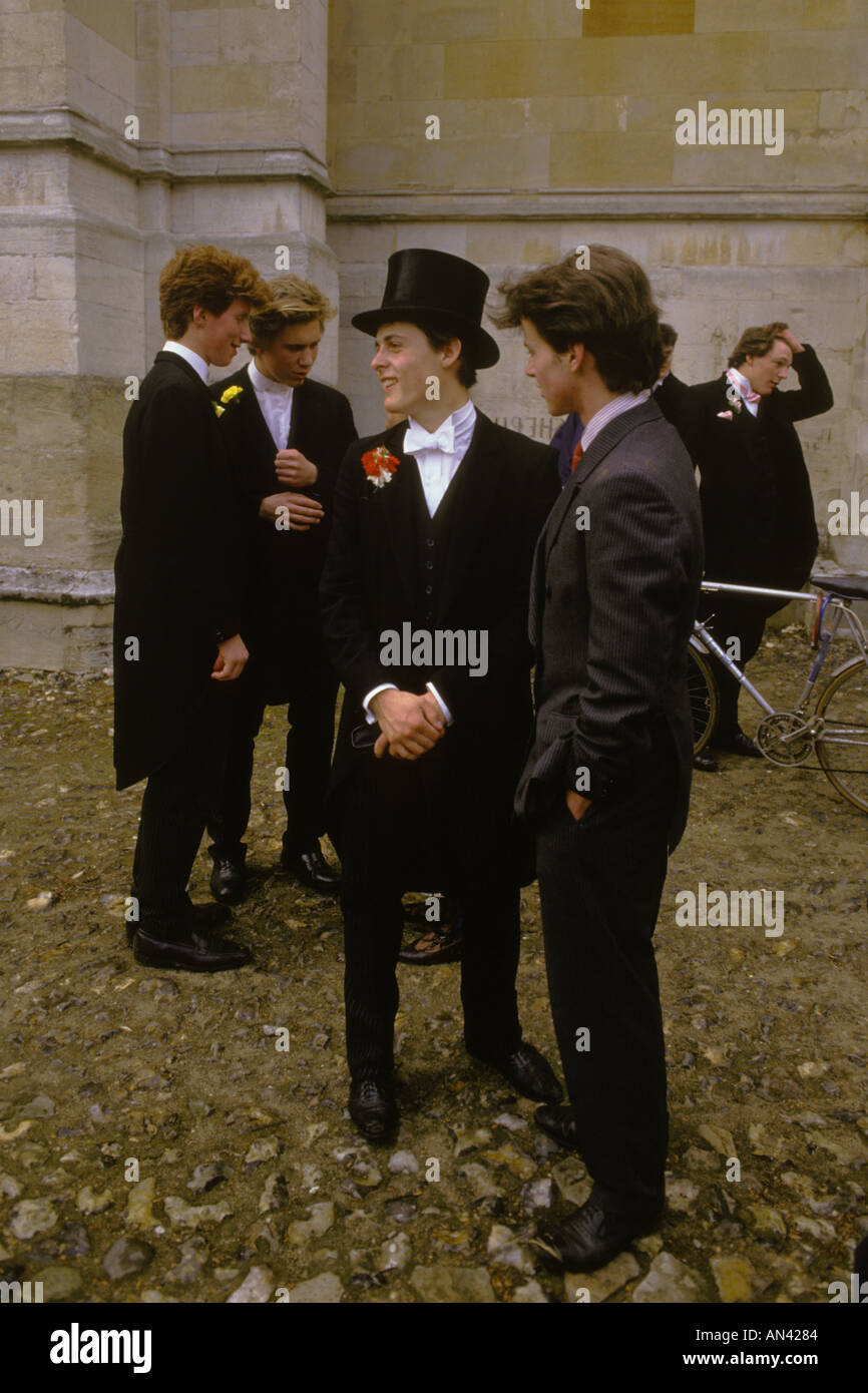 Top hat tail coat white tie Eton college school uniform. Fourth 4th of June Parents Day boys waiting to meet up. Windsor  Berkshire 1980s HOMER SYKES Stock Photo