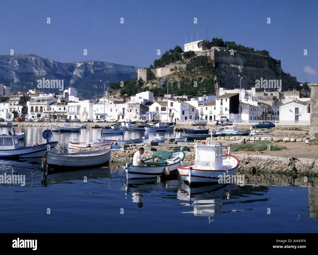 Denia Costa Blanca harbour with Castle Denia on hillside beyond Stock ...