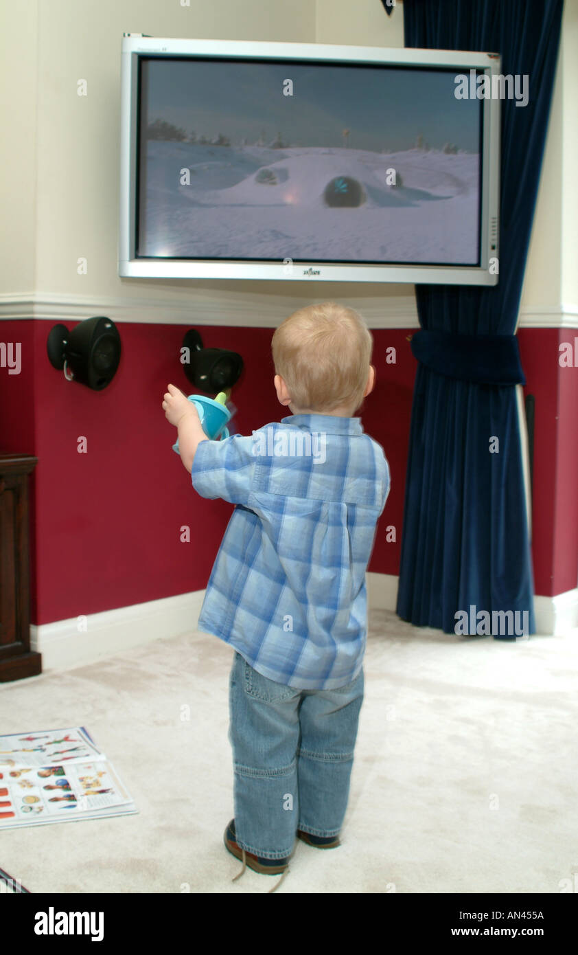 Child Watching Television Little Boy Standing looking at tv screen with