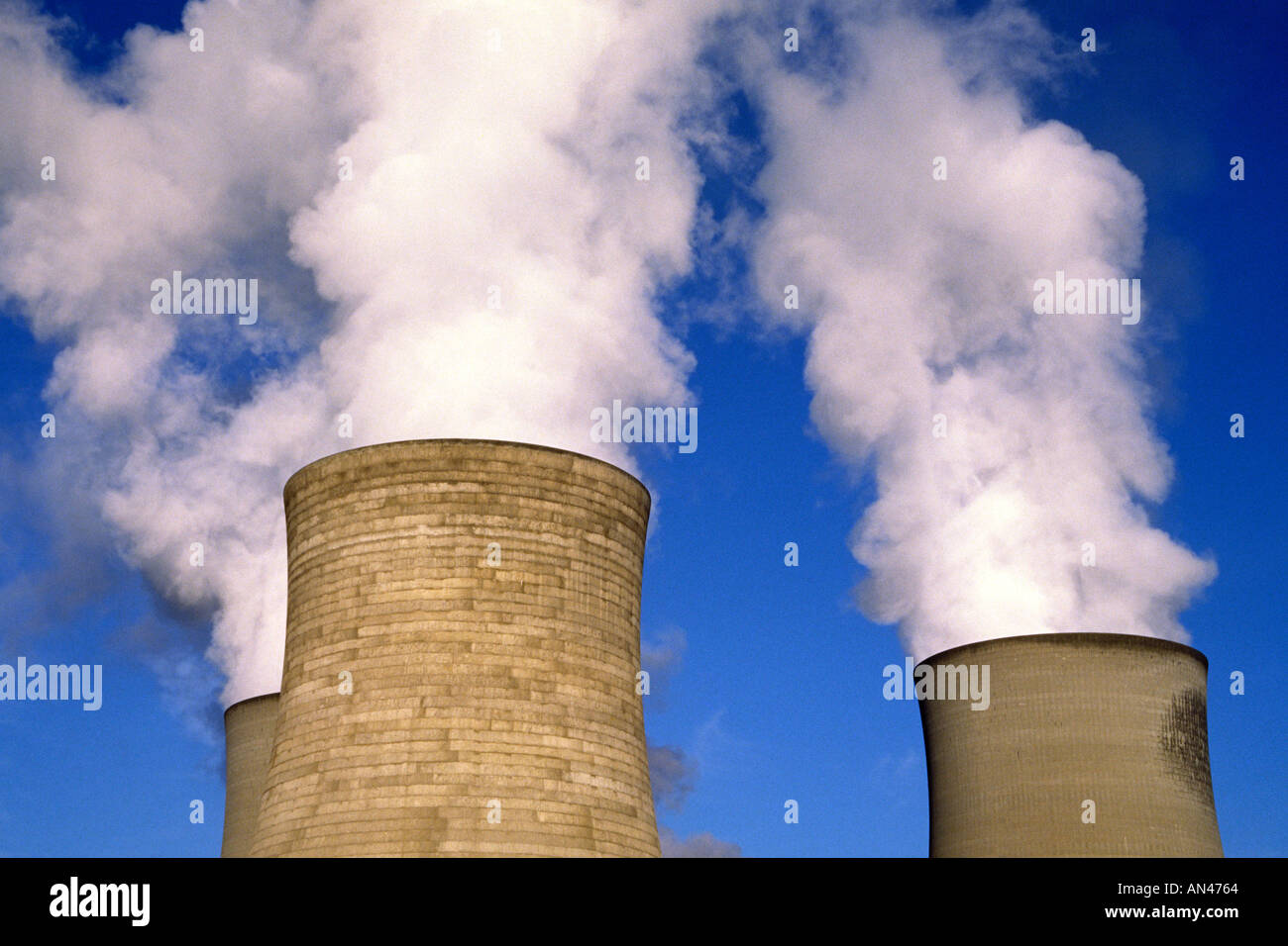 Steam from coal fired power station cooling towers England Stock Photo