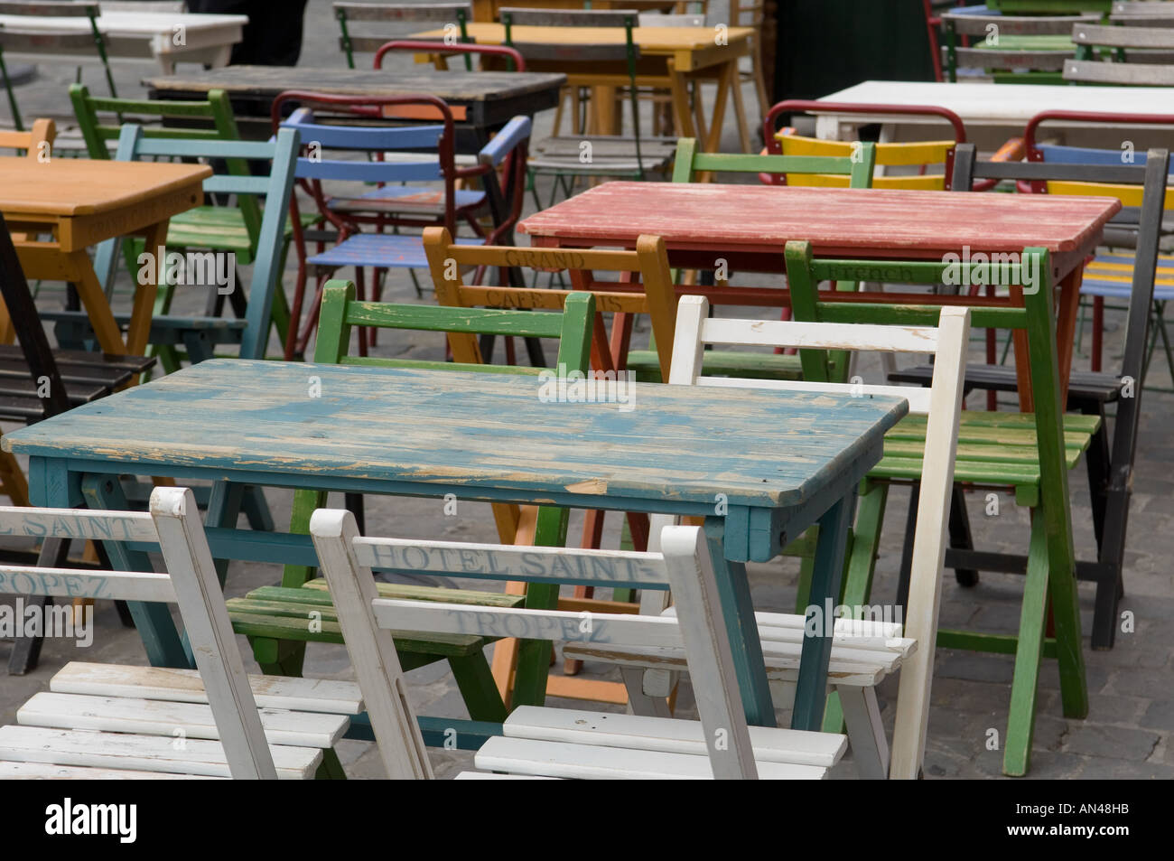 Coloured tables and chairs at a cafe in Brussels in Belgium Stock Photo