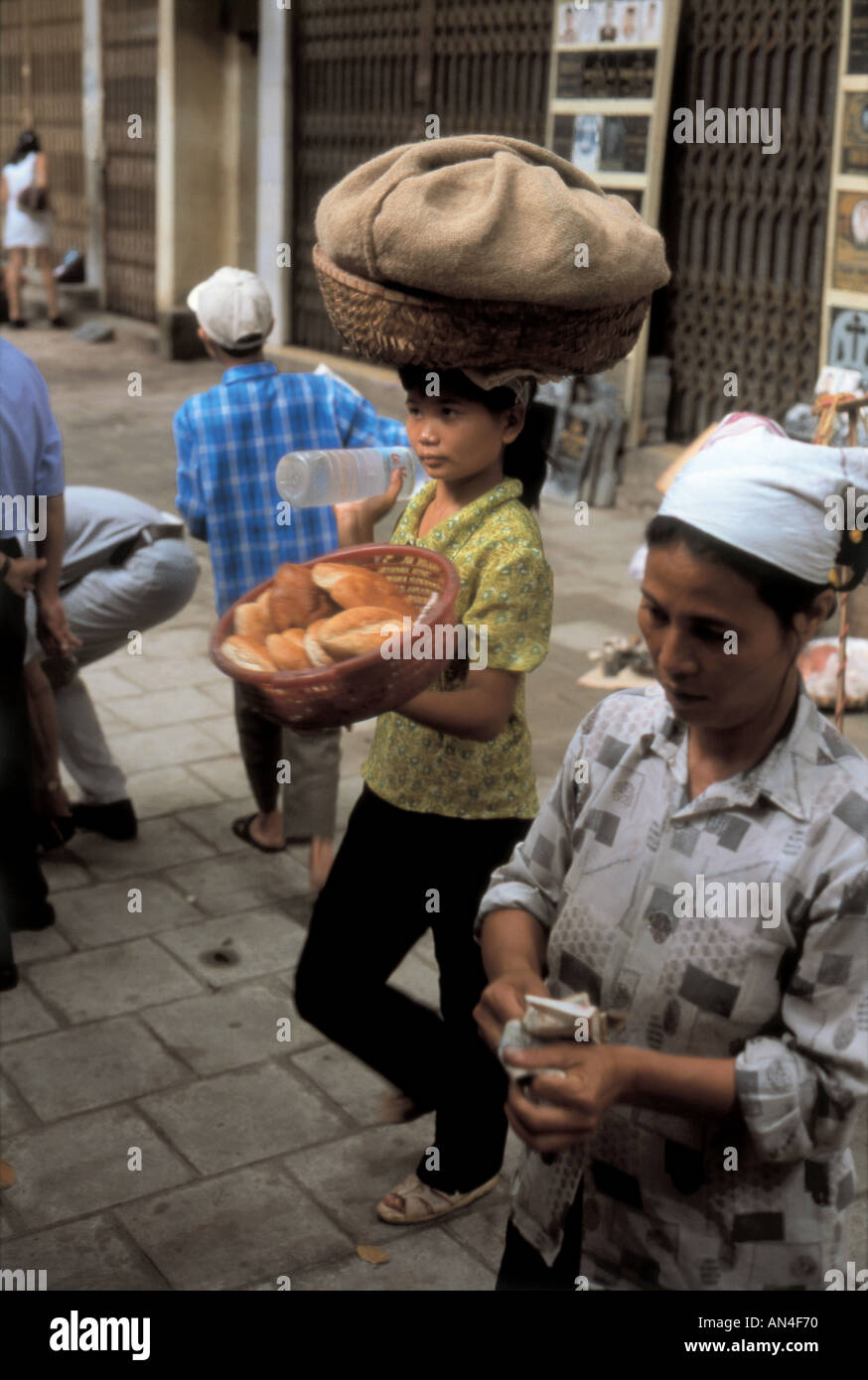Women selling food in the streets of Hanoi Vietnam Stock Photo