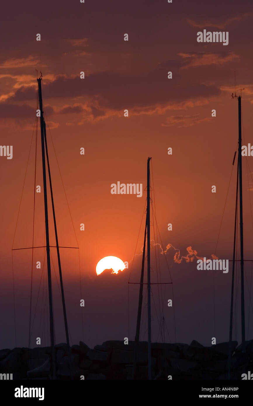 Summer sunset with mast silhouettes Stock Photo - Alamy