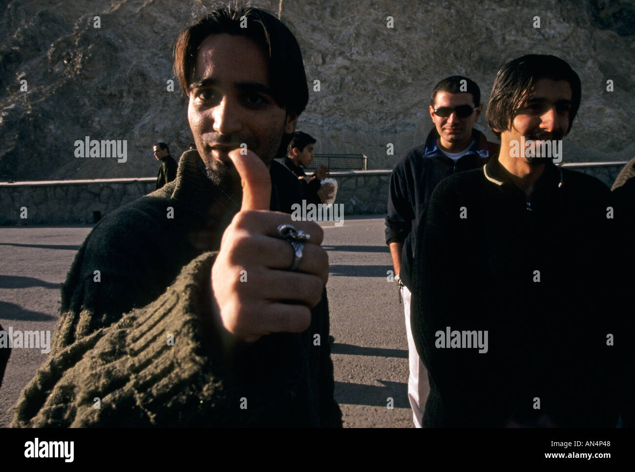 A young man gives the thumbs up in Tehran Iran Stock Photo Alamy