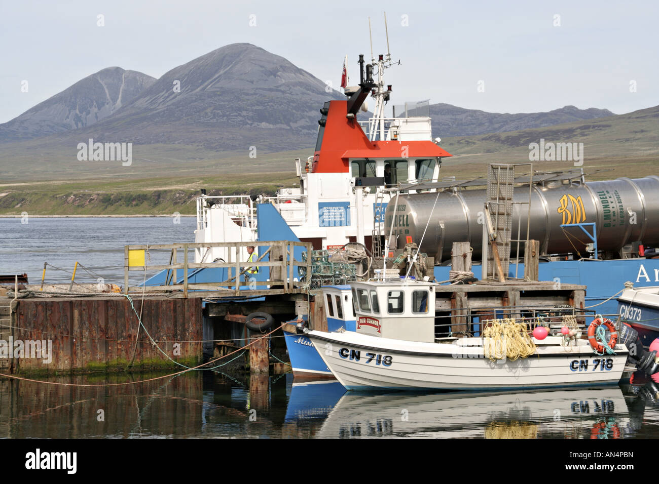 Port Askaig harbour boats isle of islay view towards jura scotland uk gb Stock Photo