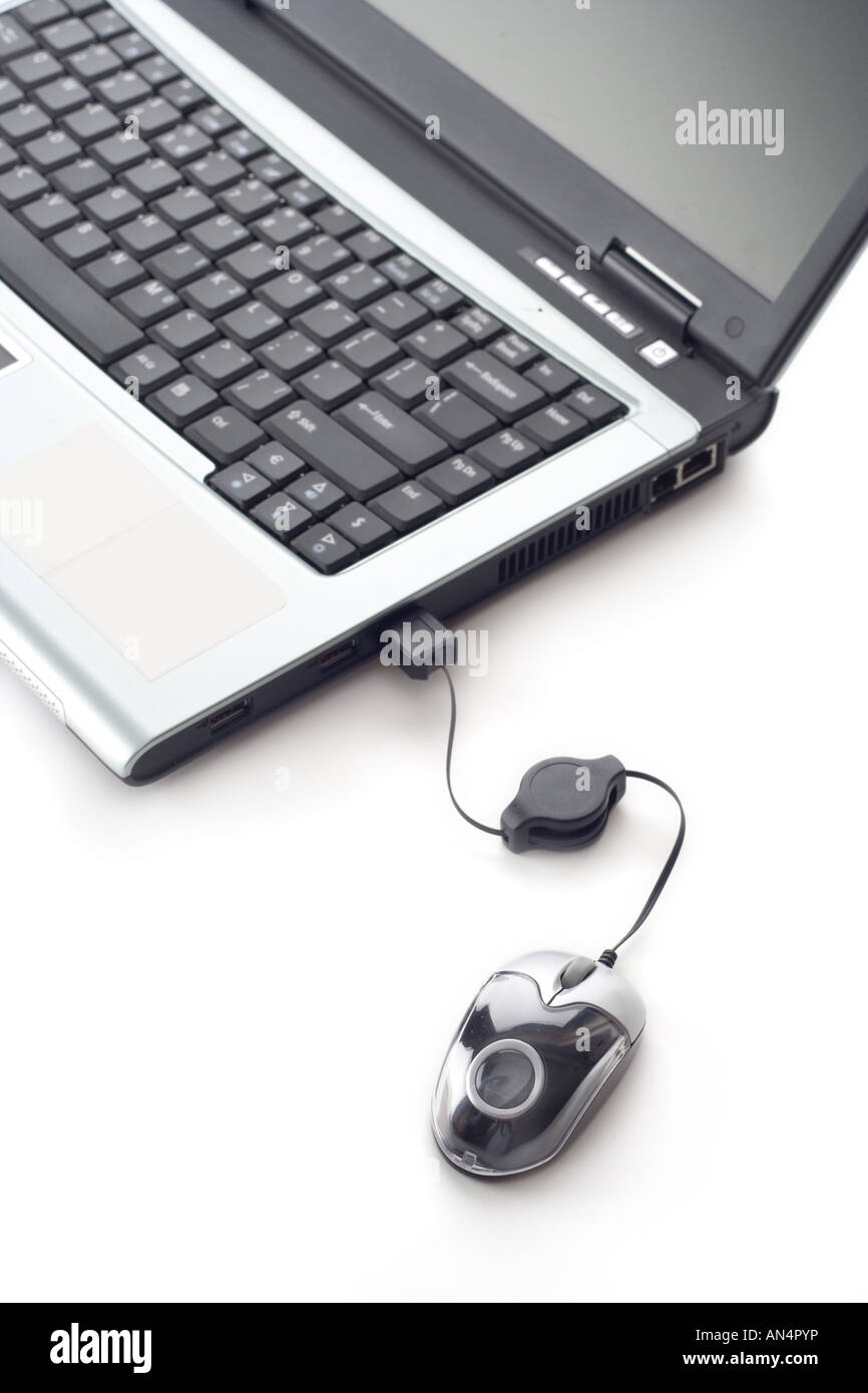 Laptop computer and a mouse Stock Photo - Alamy