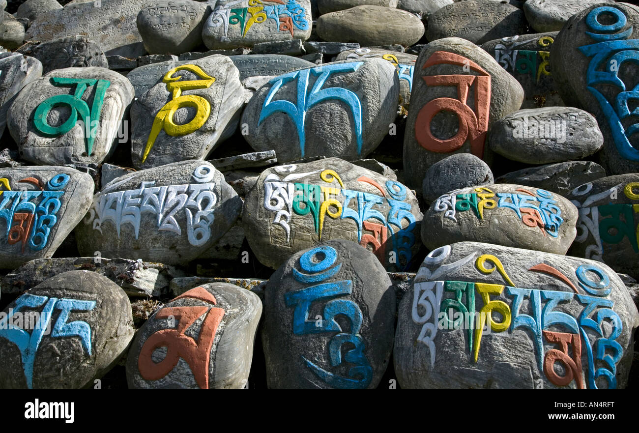 Stones with mantra text om mani padme hum. Chame village. Annapurna circuit trek. Nepal Stock Photo