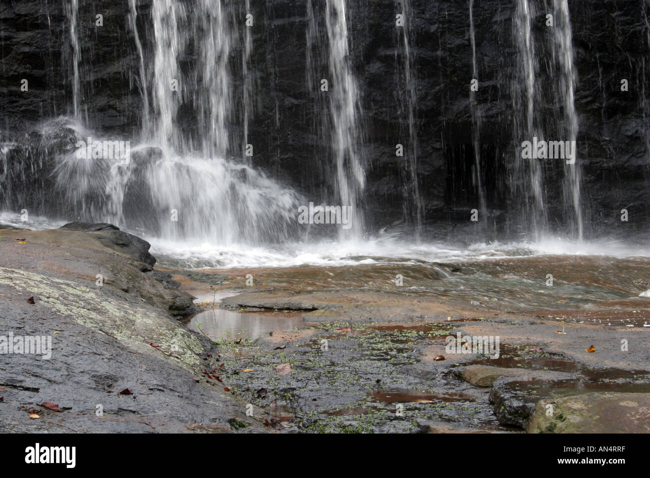 Waterfall on the rocks, streams of water are hurled down to the waiting ...