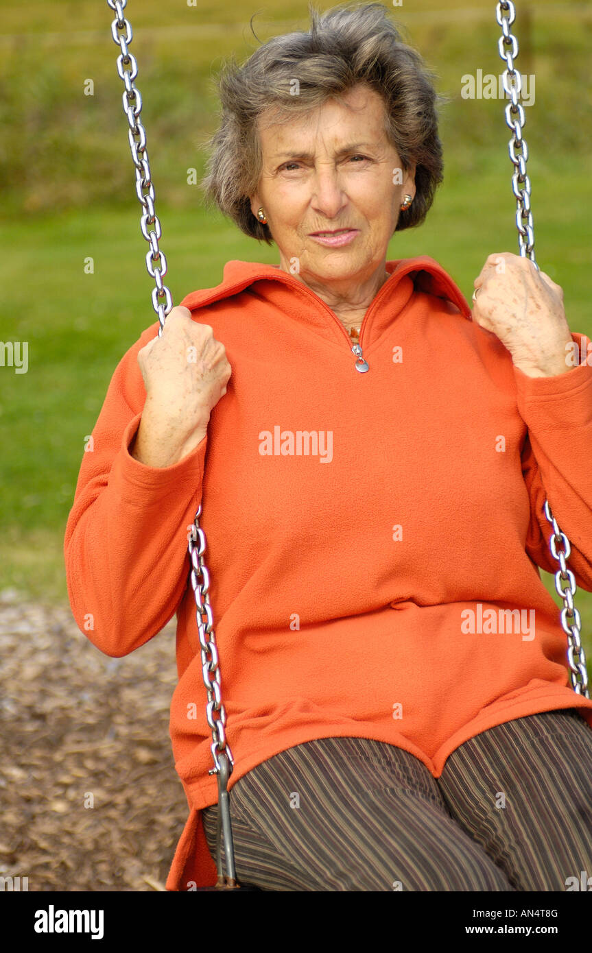 Older woman swinging hi-res stock photography and images - Alamy