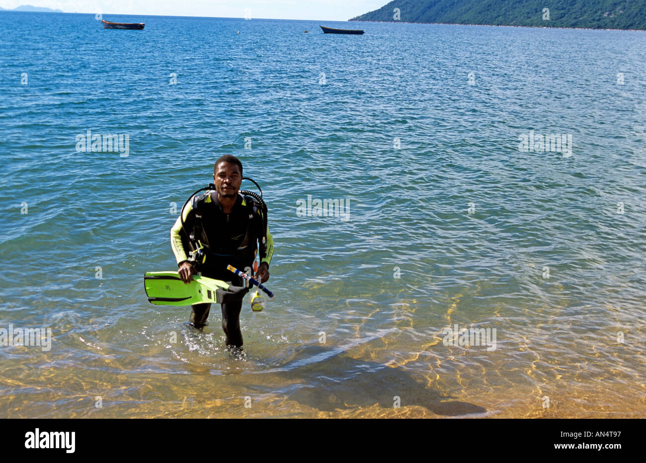 An African diver wading in the sea Stock Photo Alamy