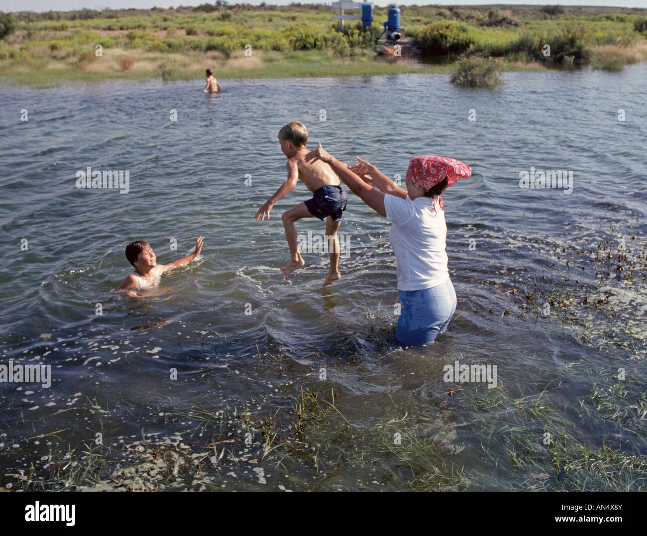 A Farm Wife And Her Children Spend A Hot Summer Day Swimming In A Stock Photo Alamy