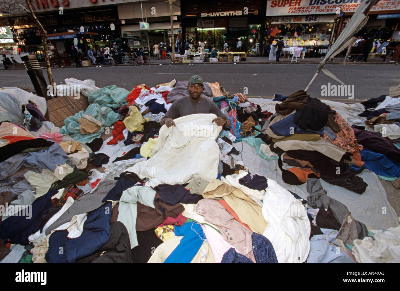 Vendor selling clothes on pavement, South Africa Stock Photo