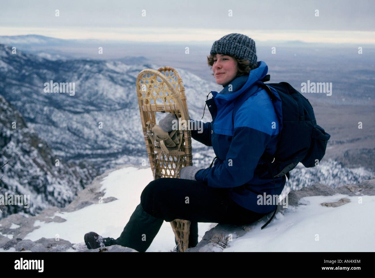 A woman on a snowshoe trip during mid winter on Sandia Peak in the
