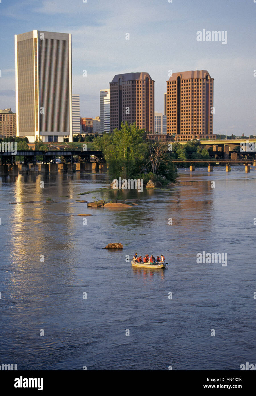 USA VIRGINIA RICHMOND White water rafters on the James River with the skyline of Richmond Virginia in the background Stock Photo