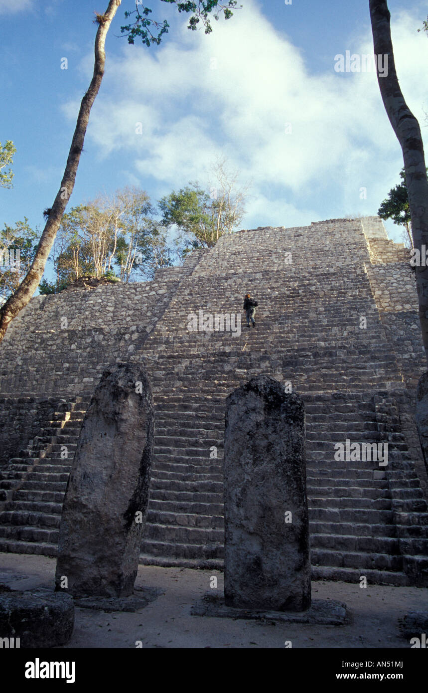 Person climbing Structure VII at the Mayan ruins of Calakmul, Campeche, Mexico Stock Photo