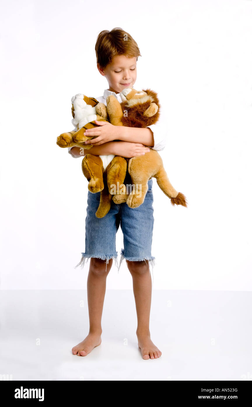 a boy holding stuffed animals Stock Photo - Alamy