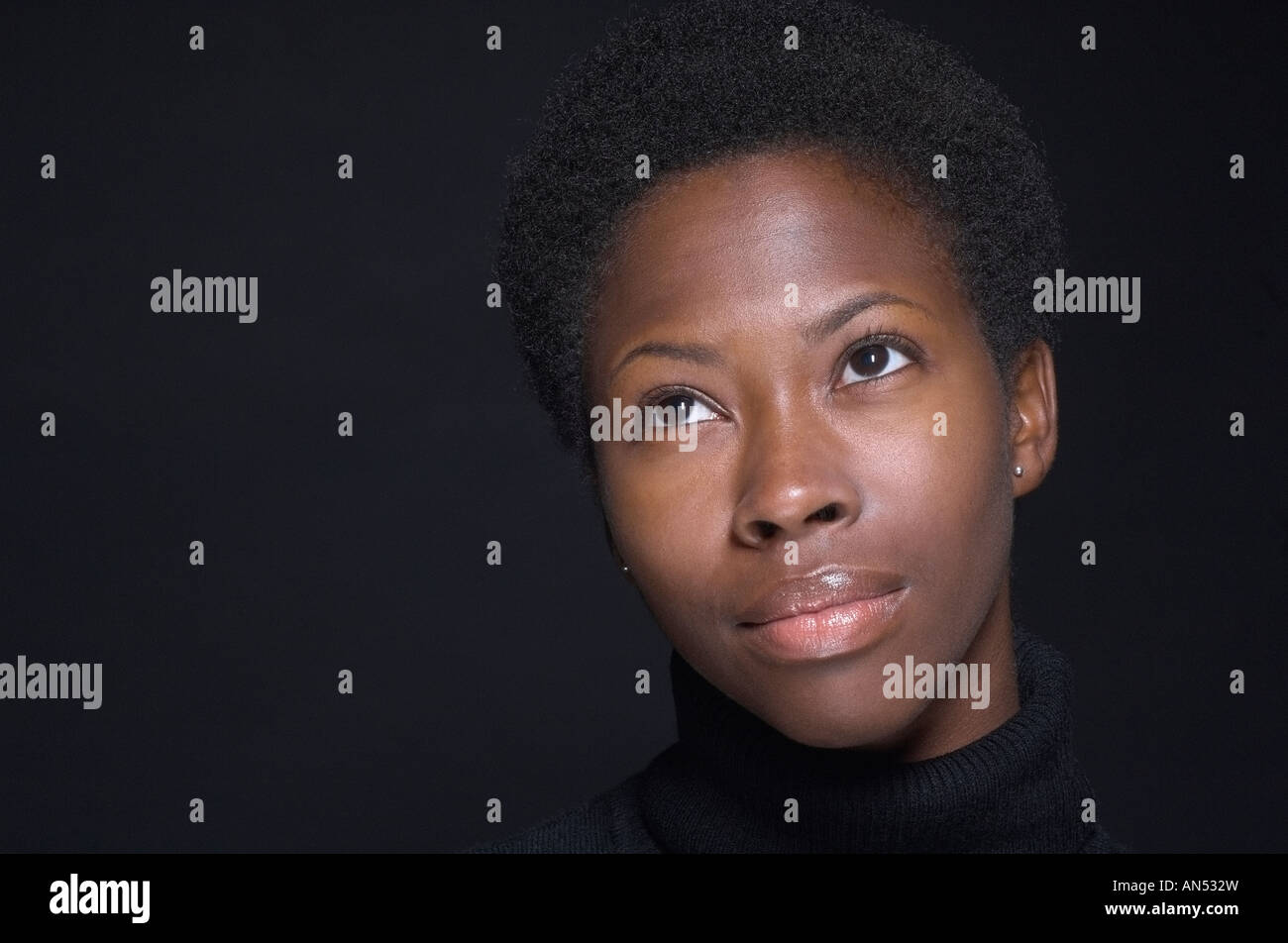 Close up of African woman looking up Stock Photo - Alamy