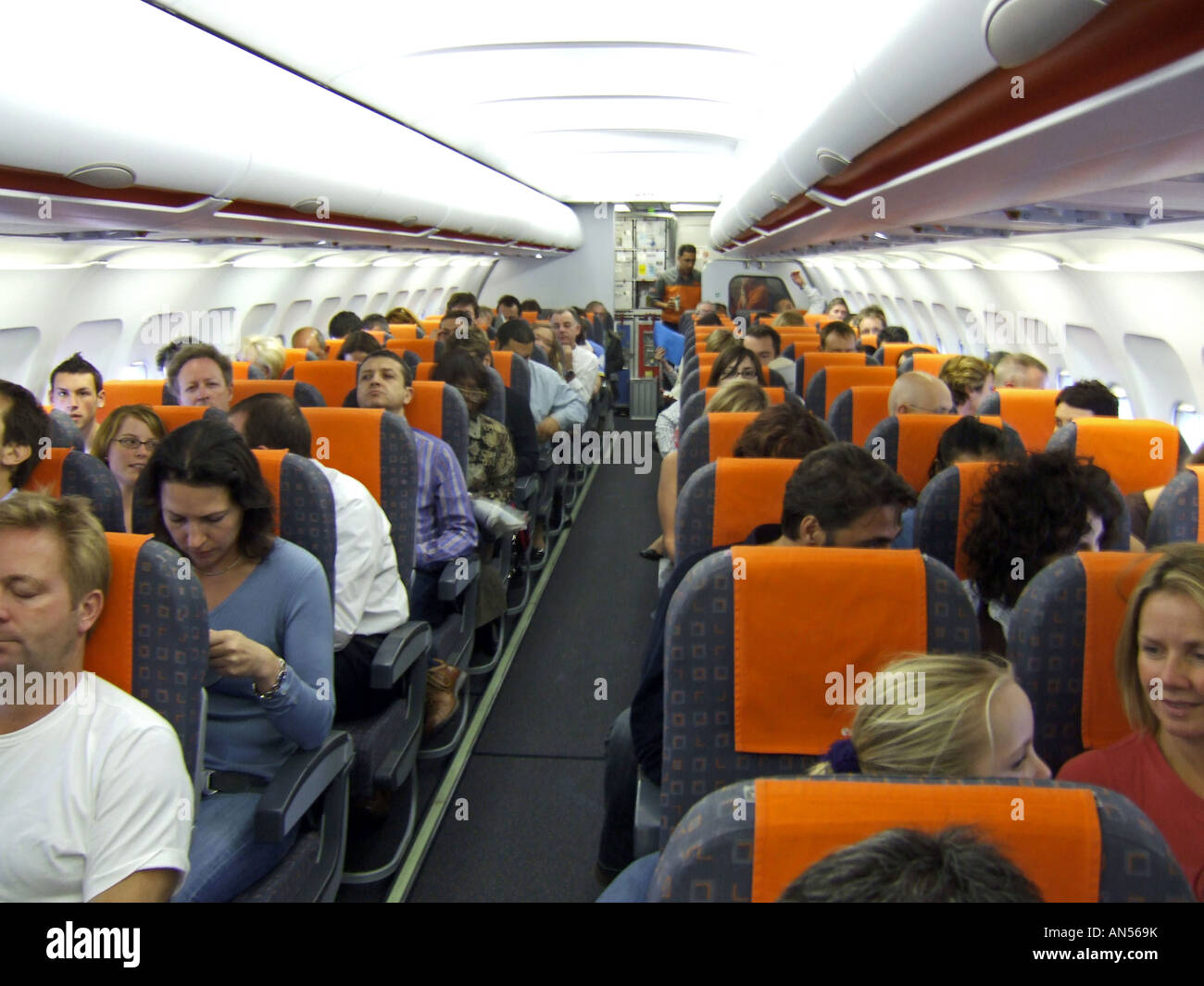 Passengers on an aeroplane Stock Photo