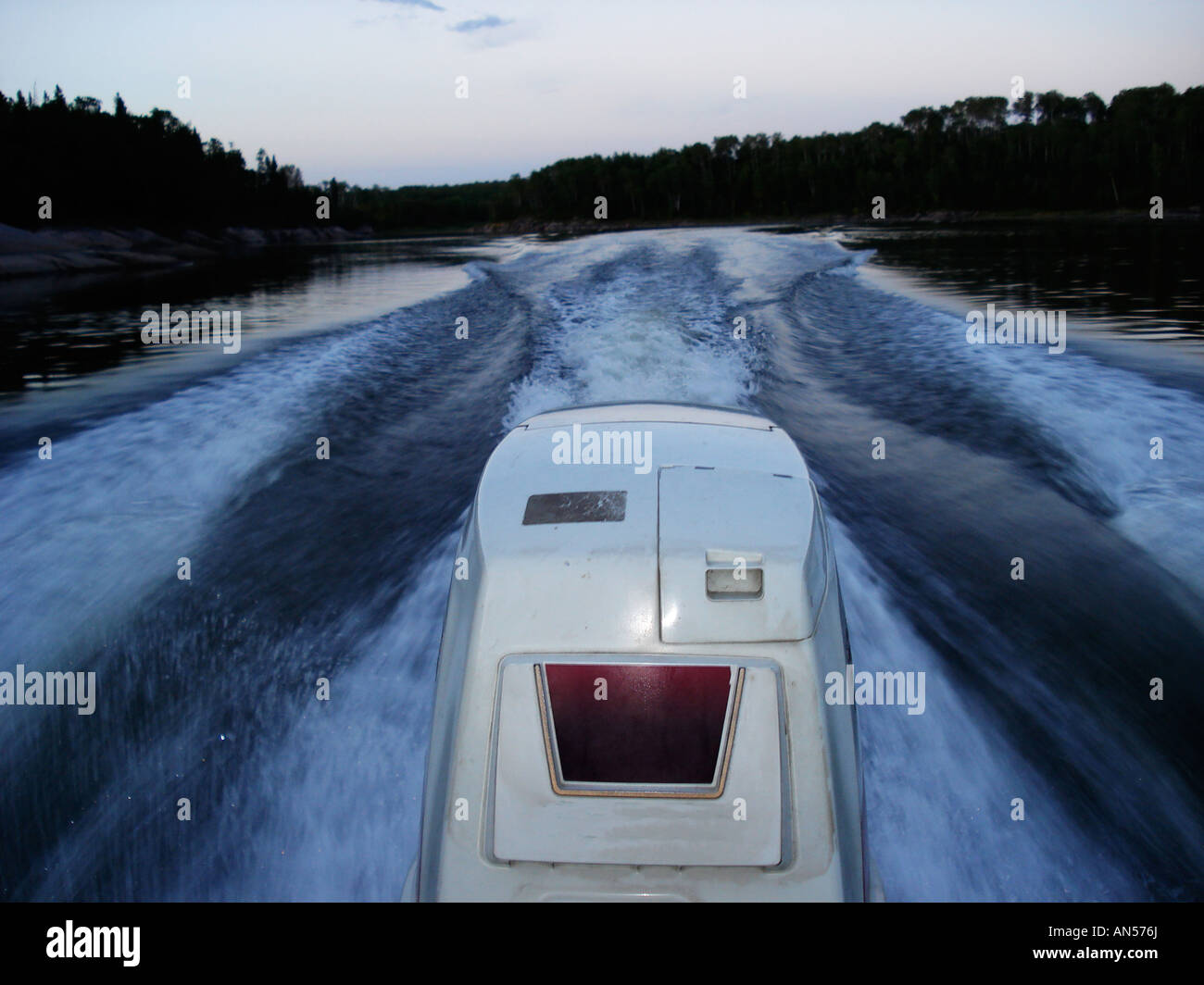 A 115 horse power outboard motor on the Winnipeg River in Ontario Canada Stock Photo Alamy