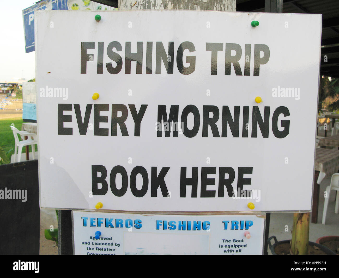 Sign for fishing trip at Taverna on Pernera beach Cyprus EU Stock Photo