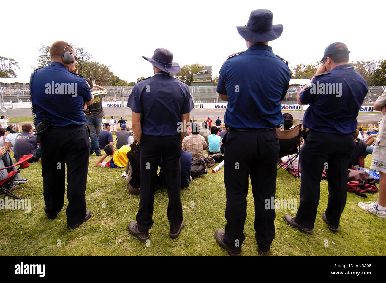 Police officers watch the Melbourne F1 Grand Prix at Albert Par Australia 2004 Stock Photo